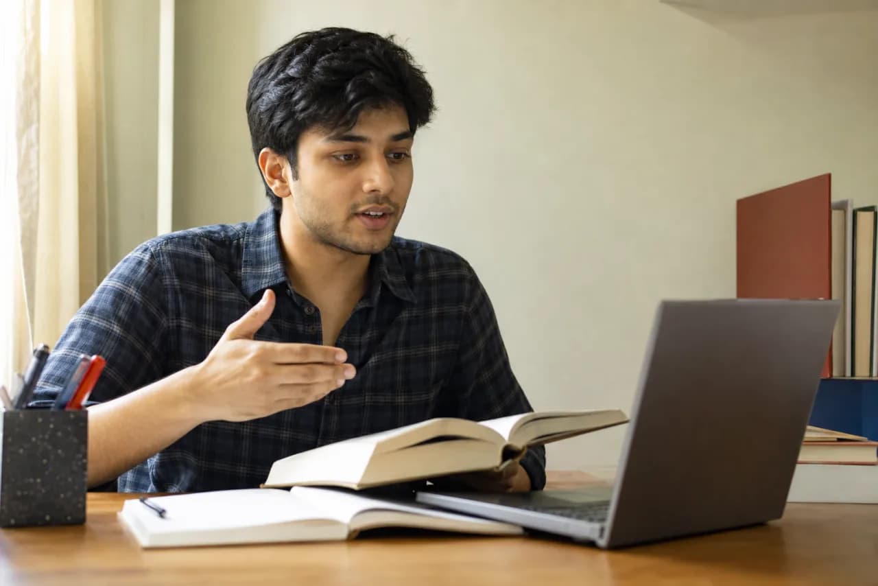 A Bengali-speaking student explaining a difficult reading aloud to create study notes